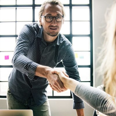 young business people shaking hands