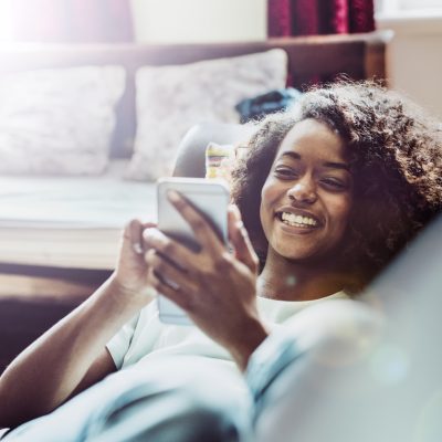 Young Woman Using Mobile Banking App