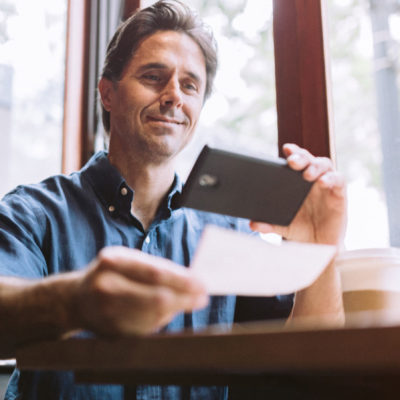 Man using Mobile Deposit on his cellular device